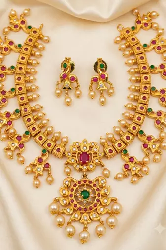 Guttapoosalu necklace set with emeralds and rubies