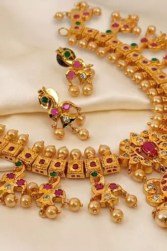 Guttapoosalu necklace set with emeralds and rubies