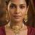 Gold-toned multi-strand pearl choker jewellery set with matching earrings