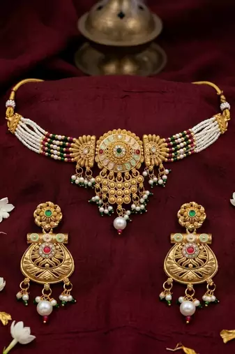 Gold-toned multi-strand pearl choker jewellery set with matching earrings