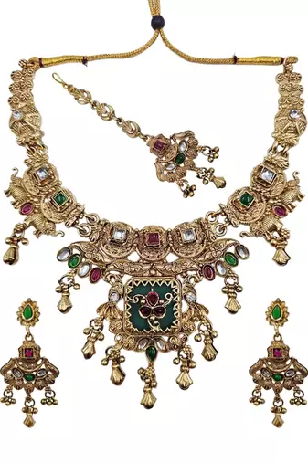 Women gold-toned & green temple antique jewellery set with maang tikka