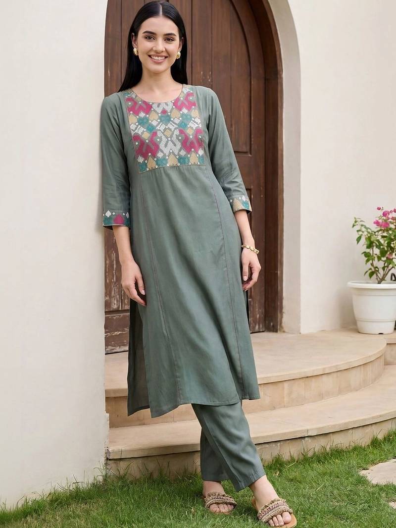 Women Embroidered Regular Thread Work Kurta with Trousers