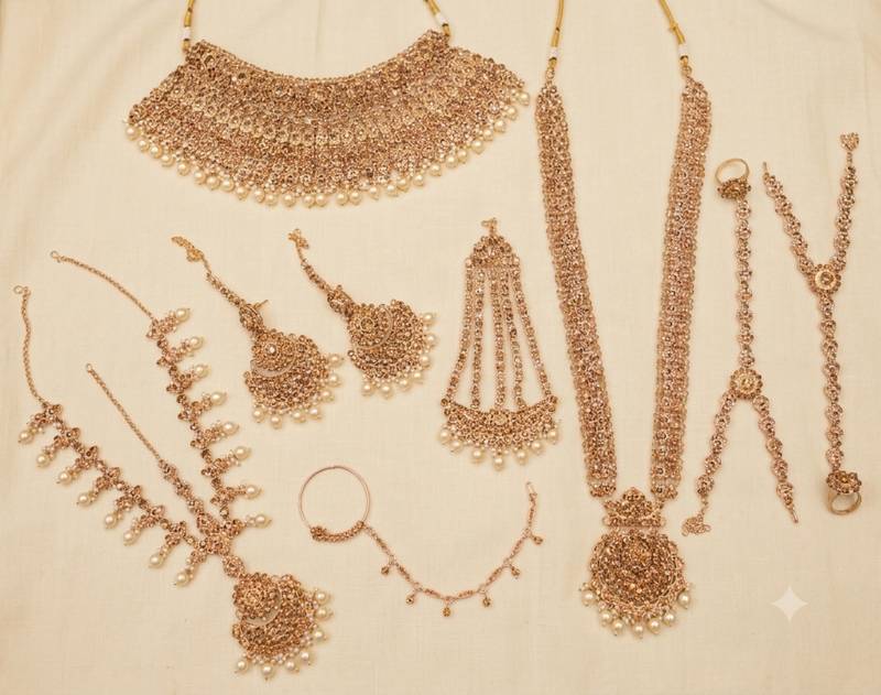 Champion color 2-layer bridal jewelry set with earrings, maang tikka, pasha, nath & panja | gold plated