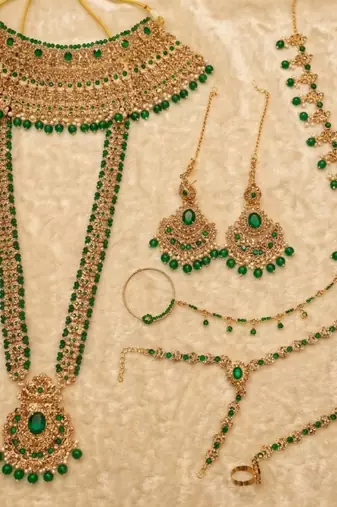 Green 2-layer bridal jewelry set with earrings, maang tikka, pasha, nath & panja | gold plated