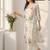 Women Floral Printed Regular Thread Work Linen Kurta with Trousers