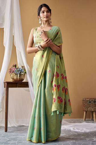 Sea green tissue silk blend floral woven saree with designer blouse