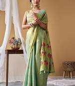 Sea green tissue silk blend floral woven saree with designer blouse