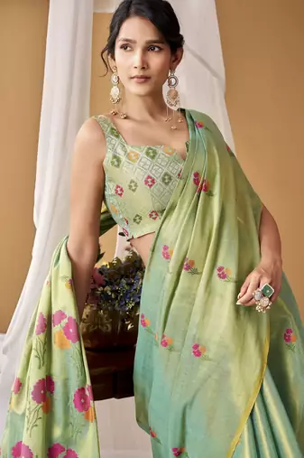 Sea green tissue silk blend floral woven saree with designer blouse