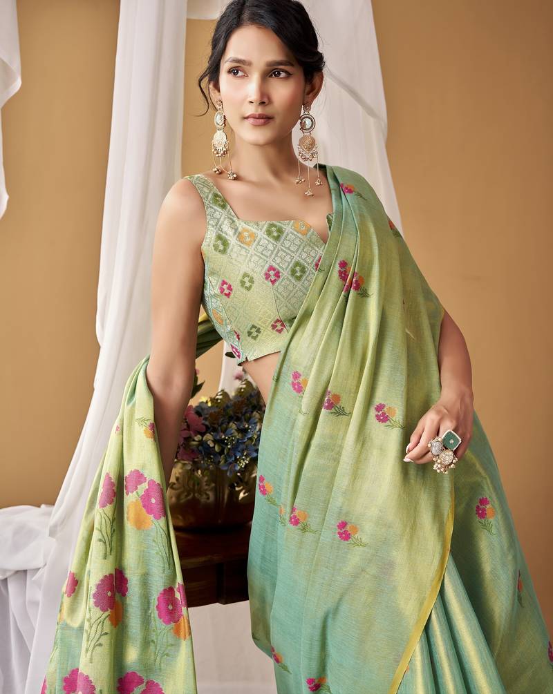 Sea green tissue silk blend floral woven saree with designer blouse