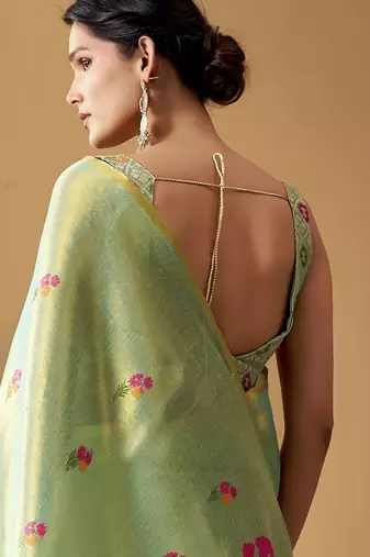 Sea green tissue silk blend floral woven saree with designer blouse