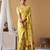 Golden yellow tissue silk blend floral woven saree with designer blouse