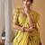Golden yellow tissue silk blend floral woven saree with designer blouse