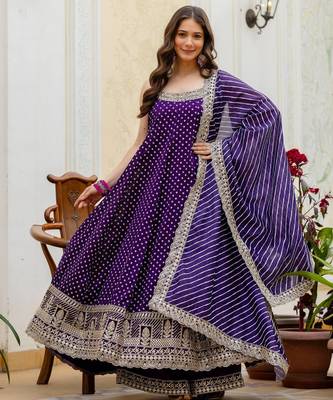 Designer halter neck bandhej kurti set with flared palazzo & leheriya dupatta for festive wear 1