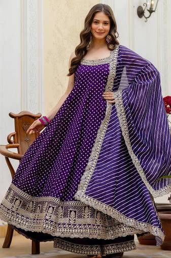 Designer halter neck bandhej kurti set with flared palazzo & leheriya dupatta for festive wear