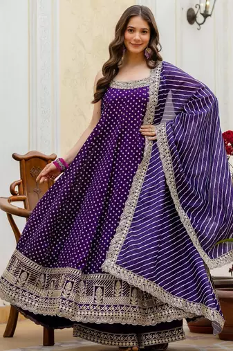 Designer halter neck bandhej kurti set with flared palazzo & leheriya dupatta for festive wear