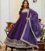 Designer halter neck bandhej kurti set with flared palazzo & leheriya dupatta for festive wear