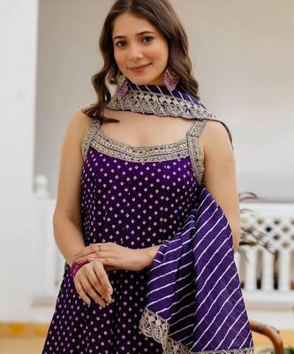 Designer halter neck bandhej kurti set with flared palazzo & leheriya dupatta for festive wear 2