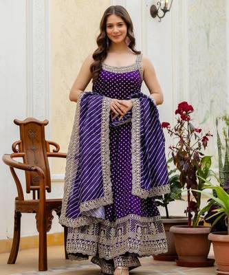 Designer halter neck bandhej kurti set with flared palazzo & leheriya dupatta for festive wear 3