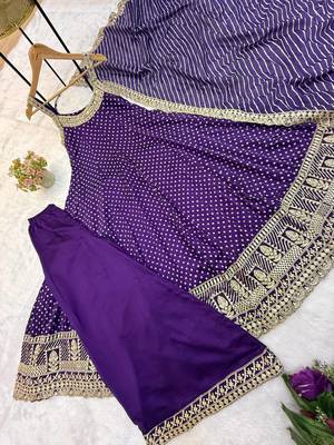 Designer halter neck bandhej kurti set with flared palazzo & leheriya dupatta for festive wear 4