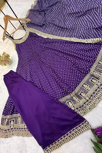 Designer halter neck bandhej kurti set with flared palazzo & leheriya dupatta for festive wear