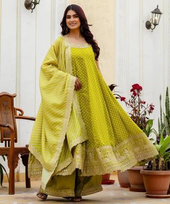 Designer halter neck bandhej kurti set with flared palazzo & leheriya dupatta for festive wear 1