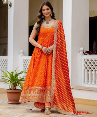 Designer halter neck bandhej kurti set with flared palazzo & leheriya dupatta for festive wear 1