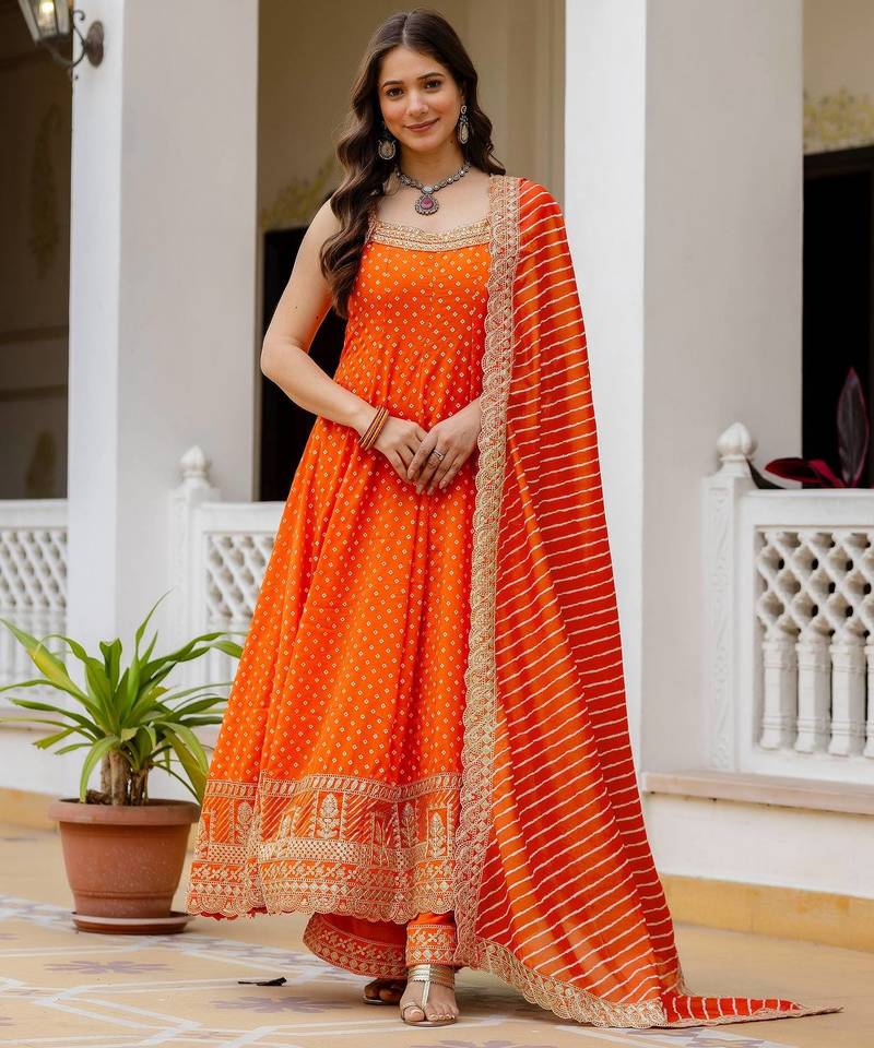 Designer halter neck bandhej kurti set with flared palazzo & leheriya dupatta for festive wear