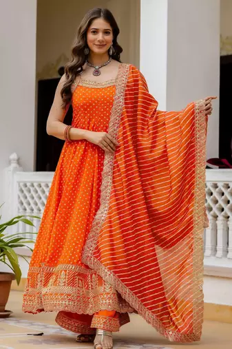 Designer halter neck bandhej kurti set with flared palazzo & leheriya dupatta for festive wear