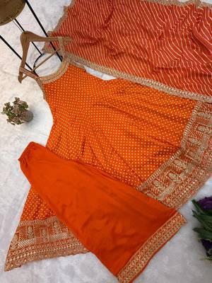 Designer halter neck bandhej kurti set with flared palazzo & leheriya dupatta for festive wear 4