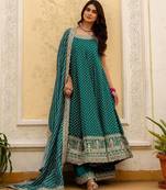 Designer halter neck bandhej kurti set with flared palazzo & leheriya dupatta for festive wear