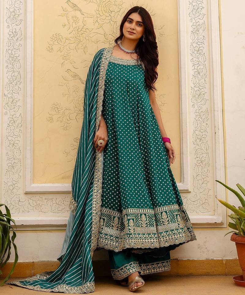 Designer halter neck bandhej kurti set with flared palazzo & leheriya dupatta for festive wear
