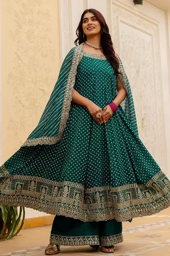 Designer halter neck bandhej kurti set with flared palazzo & leheriya dupatta for festive wear