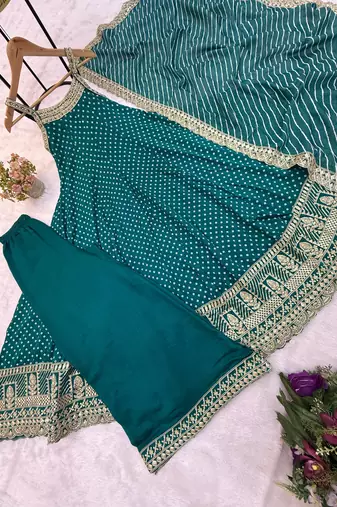 Designer halter neck bandhej kurti set with flared palazzo & leheriya dupatta for festive wear