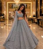 grey color Embellished With Jari Work Heavy Rainbow Dual Sequins Work Net Lehenga Choli Set