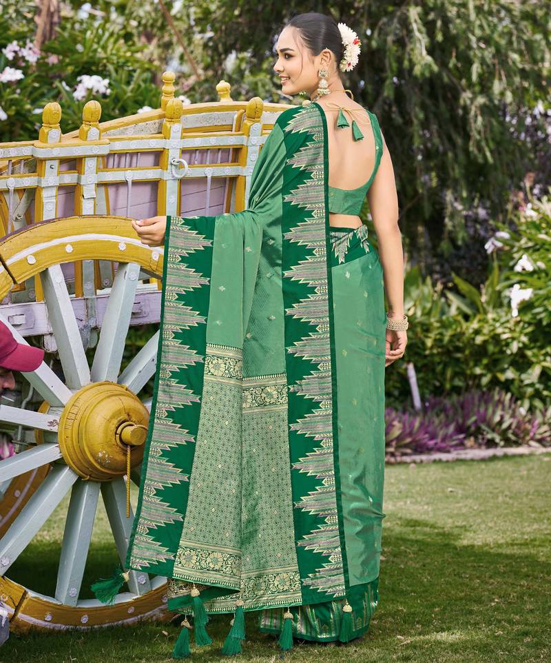 Women emerald green silk blend banarasi jacquard woven saree with blouse