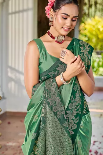 Women emerald green silk blend banarasi jacquard woven saree with blouse