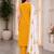 Mustard yellow embroidered sleeveless kurti set with trousers and white contrast dupatta