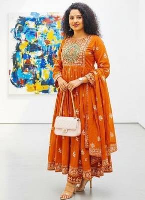 Orange cotton floral printed flared kurta set with dupatta 1