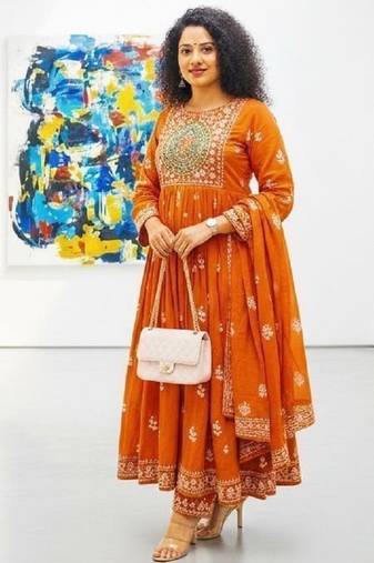 Orange cotton floral printed flared kurta set with dupatta
