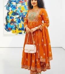Orange cotton floral printed flared kurta set with dupatta