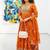 Orange cotton floral printed flared kurta set with dupatta