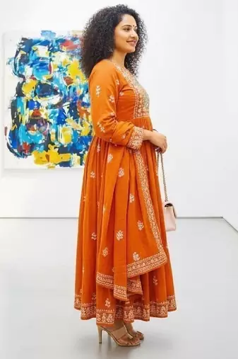 Orange cotton floral printed flared kurta set with dupatta
