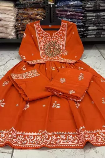Orange cotton floral printed flared kurta set with dupatta