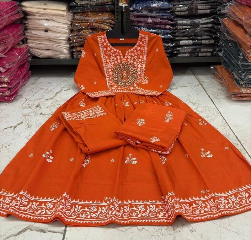Orange cotton floral printed flared kurta set with dupatta