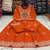 Orange cotton floral printed flared kurta set with dupatta