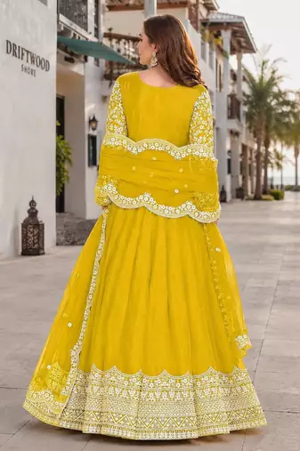 Yellow embroidered net semi stitched anarkali suit