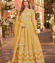 Yellow embroidered net semi stitched anarkali suit