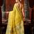 Yellow premium tissue silk blend saree with tassels & blouse piece