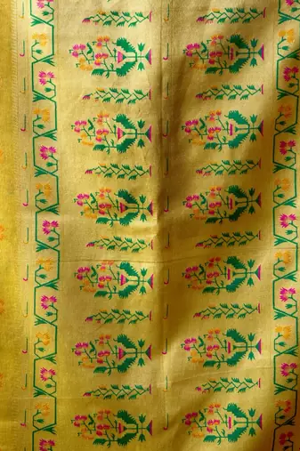 Yellow premium tissue silk blend saree with tassels & blouse piece