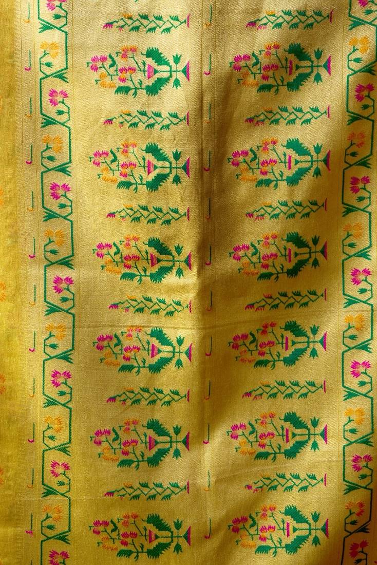Yellow premium tissue silk blend saree with tassels & blouse piece